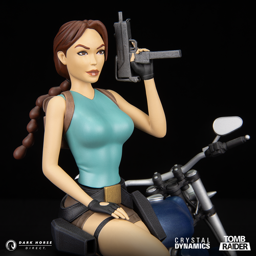 Lara Croft classic era, leaning against her motorbike forward facing right zoomed in on Lara in the statue